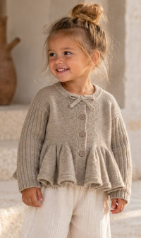 Peplum Knit Cardigan in Taupe, worn by a child